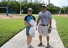 Megan and Steve Johnston took part in cleaning up the bay. Megan is apart of an environmental club at King Middle School, which participated in the day.
