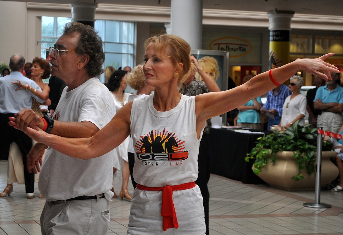 Steve Litwack and Denise Barth show off their dancing skills during the D2L Dance Party "Behind The Ropes" Sunday, Sept. 25, at the Westfield Southgate Mall.