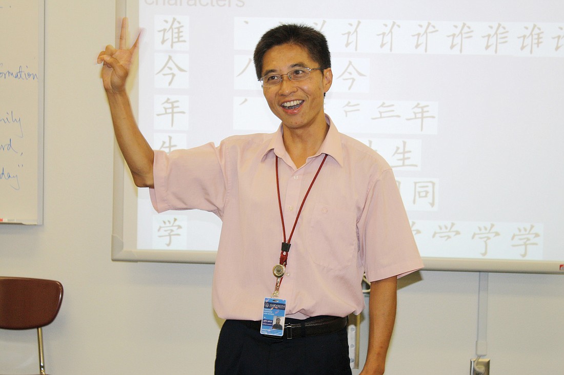 Xiaotian Tang, or "Frank," teaches his students how to speak about birthdays in Chinese.
