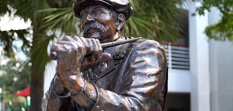 This statue was created in 1994 by Jack Dowd and is called "Royal St. George's". Where is it located?