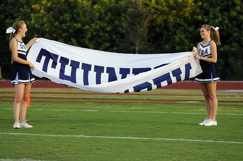 Emma Holland and Sarah Nimptsch continue to cheer on the Thunder no matter how the team fairs on the field.