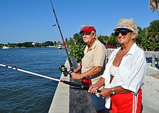 Larry and Betty Royston hoped to catch themselves dinner by fishing at Bay Island Park. The couple also brought along a picnic of Bloody Marys and Burger King to enjoy while they fished.
