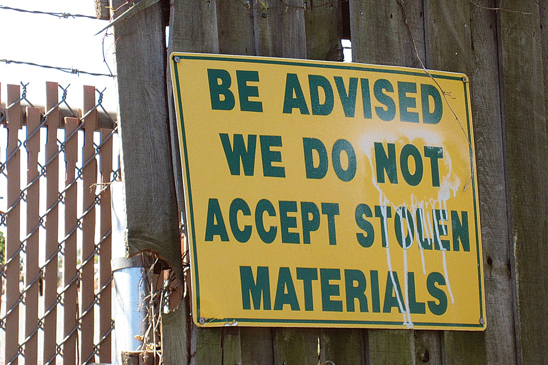 Suncoast Metals on 51st Street in Sarasota has signs posted warning people not to try to sell stolen goods.