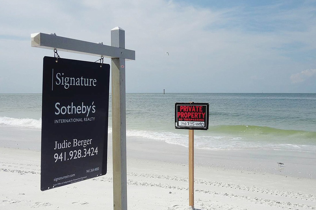 Neighboring residents complained when Andy Cooper installed real estate and "Private Property" signs on the portion of the beach residents considered public access. Courtesy photo.