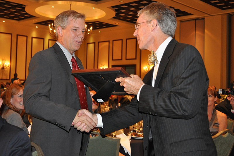 Willis A. Smith Construction President David Sessions receives a finalist award from The Observer Group Editor and CEO Matt Walsh.