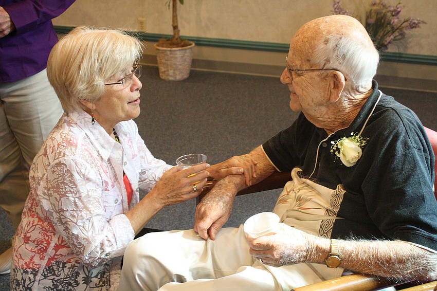 Friend Carol Fischbein bids Jim Brown a Bon Voyage.