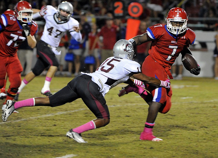 Braden River defensive back Jordan Edwards attempts to keep Manatee running back Leon Allen from reaching the end zone.