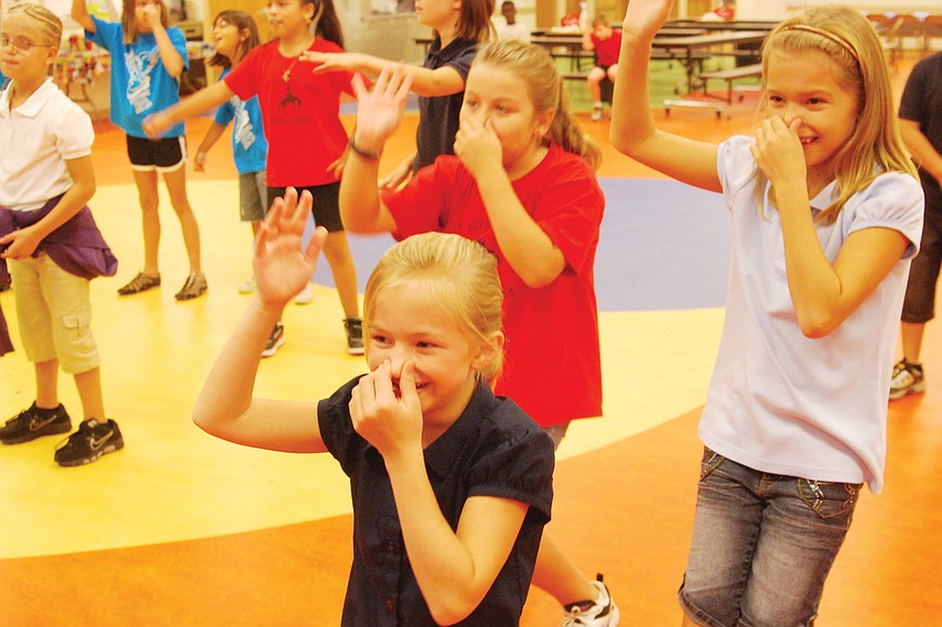 Third-grader Samantha Pondillo, front, had fun dancing with friends.