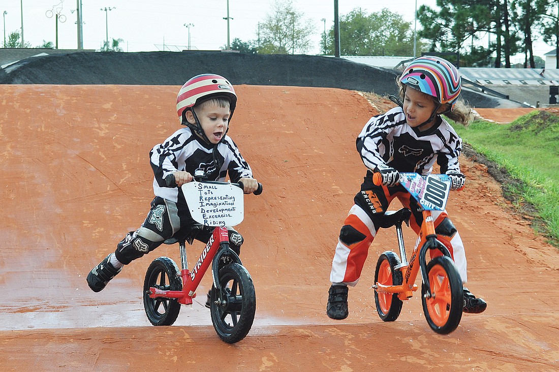 Devin Miller and JoJo Zolikoff race each other on the BMX track. Loren Mayo.