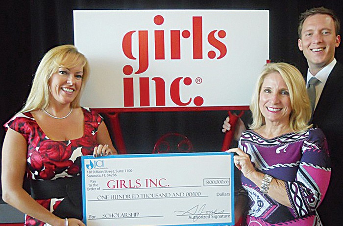 Susan Jones, executive vice president of JCI Chemical, Stephania Feltz, executive director of Girls Inc., and Max Hannum, vice president of human resources of JCI Chemical. Courtesy photo.