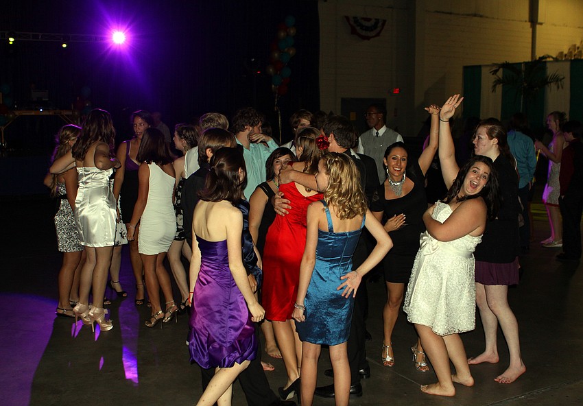 Students dance together on the dance floor Saturday, Oct. 15 during the Sarasota High School homecoming dance at Robarts Arena.