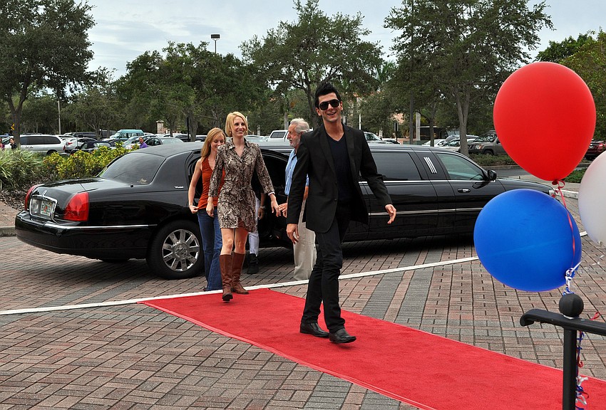Dancers exit a limo and make their way up the red carpeted stairs to meet with the rest of their company, Monday, Oct. 17 at the FSU Center for the Performing Arts.