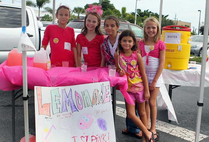 Erin Luhrsen, Ashlynn Rutherford, Savina Koda, Sofia Koda and Ansley Jackson ran a pink lemonade stand out in the parking lot. Last year the girls raised $57.