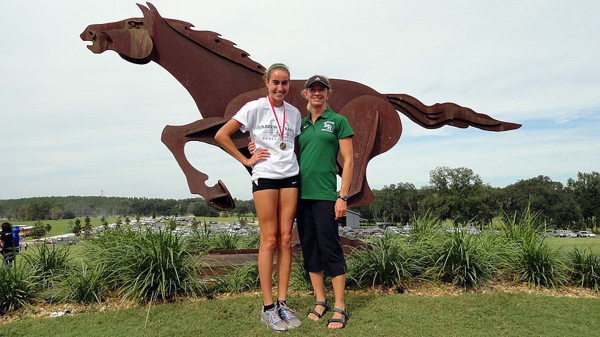 Lakewood Ranch High junior Olivia Ortiz, pictured with cross country coach Mary Quinn, won the Pre-State Invitational Oct. 15.