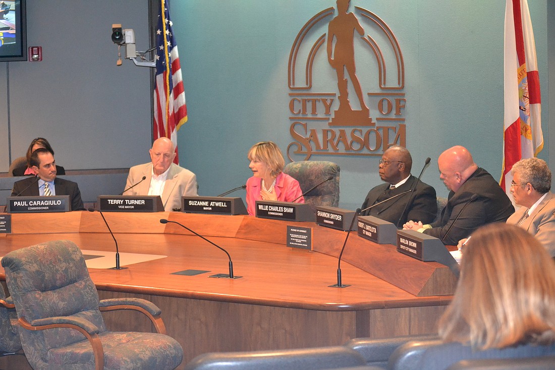 City commissioners discussed a police contract for five hours Monday night at City Hall.