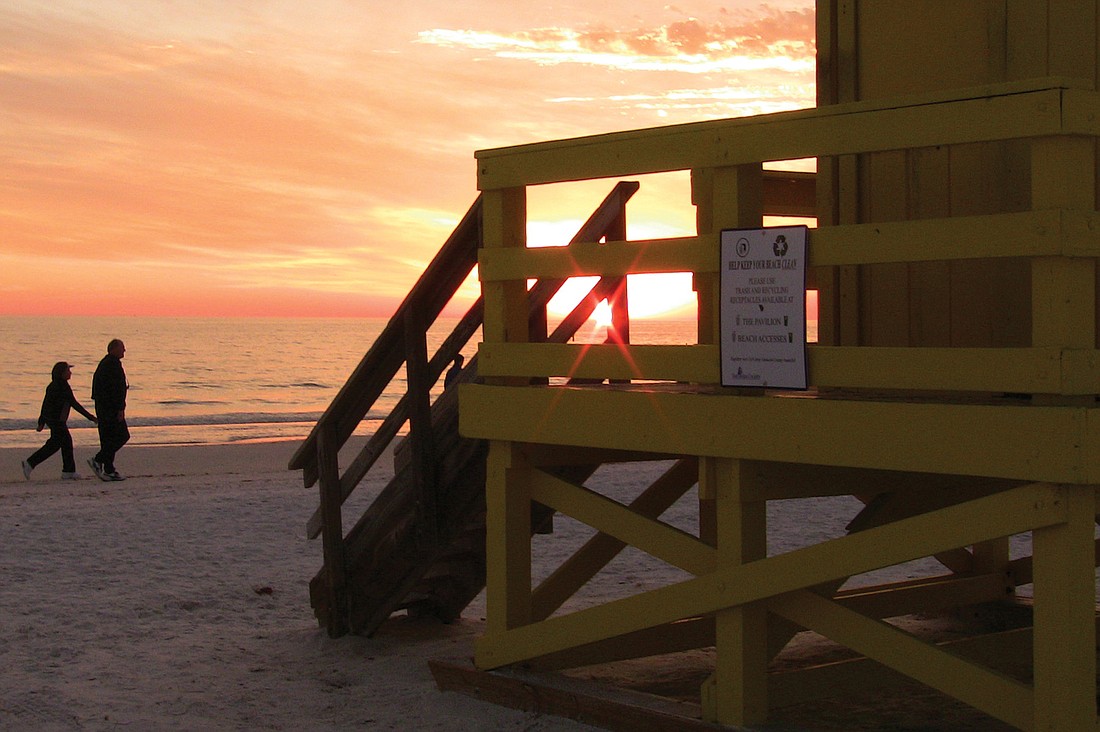 Robin Draper submitted this photo of a couple on a sunset stroll along the Siesta Public Beach.