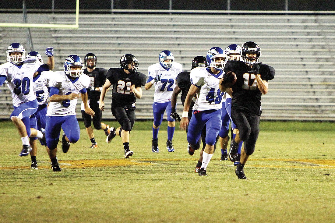 Michael Dancer, No. 17, makes his way down the field to score a touchdown for the Sarasota Sailors Friday, Oct. 14, during the homecoming game against the East Lake Eagles at Cleland Stadium. Sarasota High lost 38-52.Ã‚Â Photo by: Rachel S. O'Hara