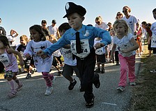 Dressed as a policeman, 4-year-old Ethan Armor proved to be one of the fastest runners.