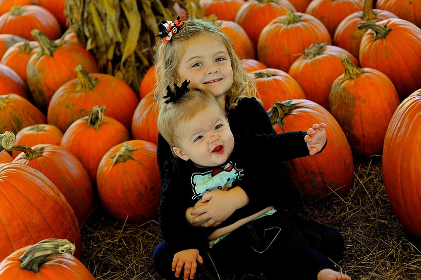 Five-year-old Eva Dyer and her younger sister Ella, 10 months, couldnâ€™t wait to stop by the pumpkin patch.