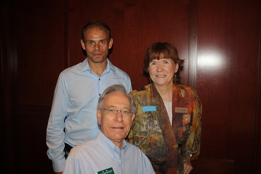 Chris Digham with Exotica Florist, Norm Mallard with Hughes Exterminators and Nancy J. Taussig with Barefoot Weddings