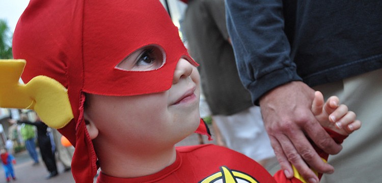 Conor O'Neil, 3, watched the dunk tank with his father, Greg.