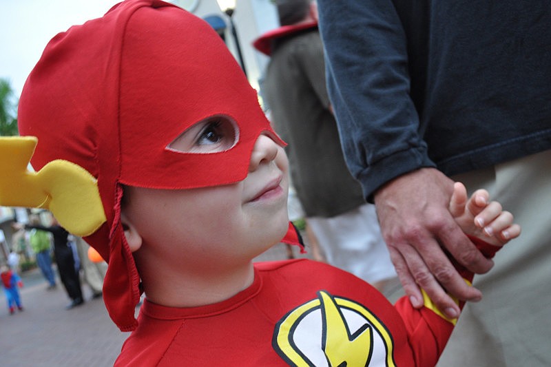 Conor O'Neil, 3, watched the dunk tank with his father, Greg.
