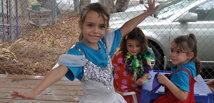 Linda Harris shows off her ballerina princess skills for Claire Macaluso and Giovanna Hansen.