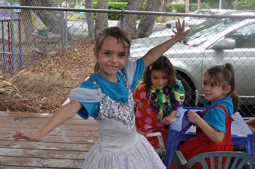 Linda Harris shows off her ballerina princess skills for Claire Macaluso and Giovanna Hansen.