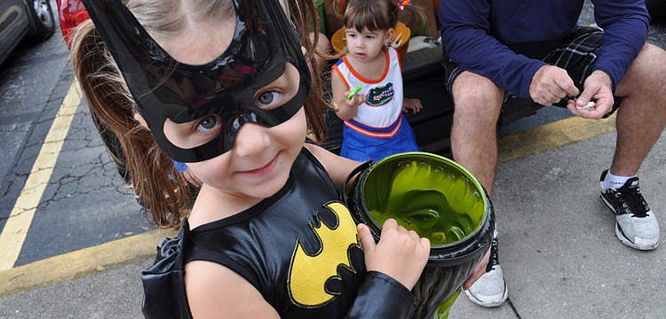 Alexandra Griffin, 5, stocked up on candy during Braden River Elementaryâ€™s Harvest Moon Bash Oct. 29.