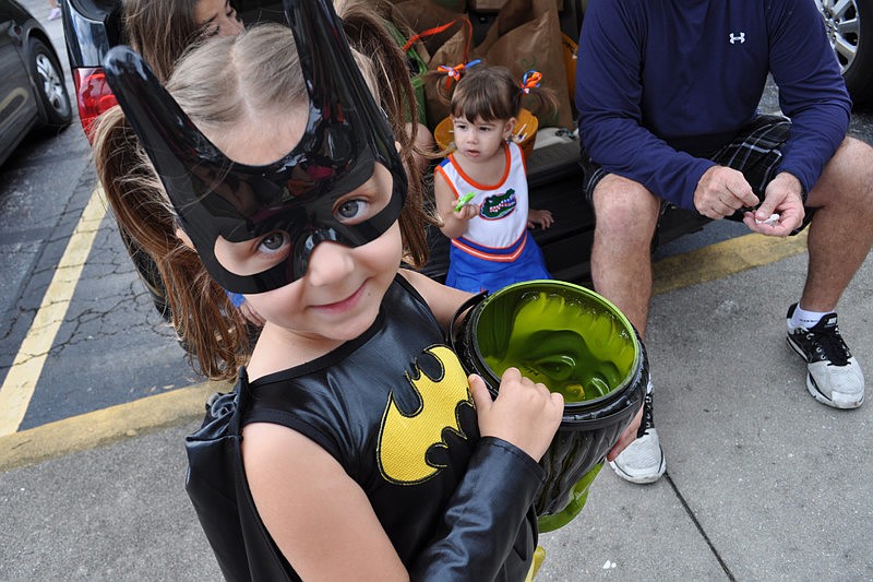 Alexandra Griffin, 5, stocked up on candy during Braden River Elementaryâ€™s Harvest Moon Bash Oct. 29.