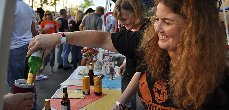 Main Street Travel's Isabel Lund-McCarthy poured Czechvar beer for guests.