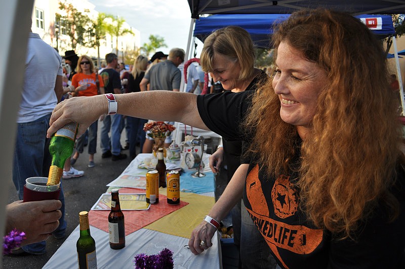 Main Street Travel's Isabel Lund-McCarthy poured Czechvar beer for guests.