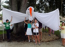 NewGate students hold up the peace dove.