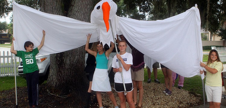 NewGate students hold up the peace dove.