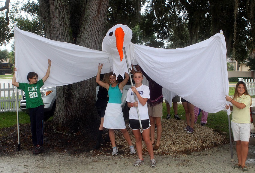 NewGate students hold up the peace dove.