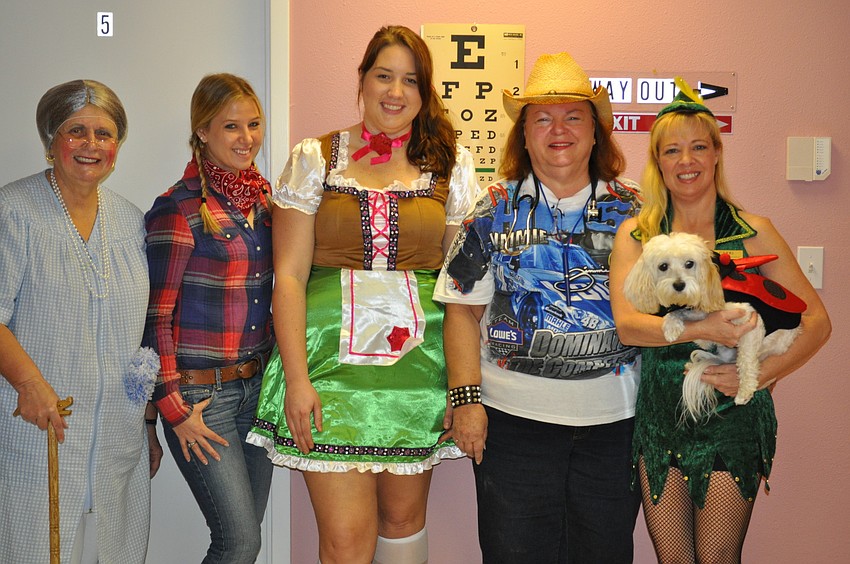 Winnie Schroeder, Kathryn Winn, Amanda Wilson, Dr. Pam Letts, Gerri O'Brien and Bella Letts get into the Halloween spirit at Centre Shops Family Practice.