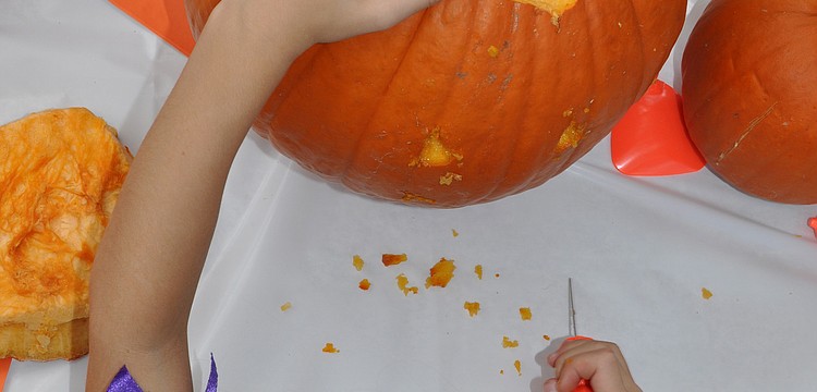 Ava Oâ€™Hara carves her pumpkin