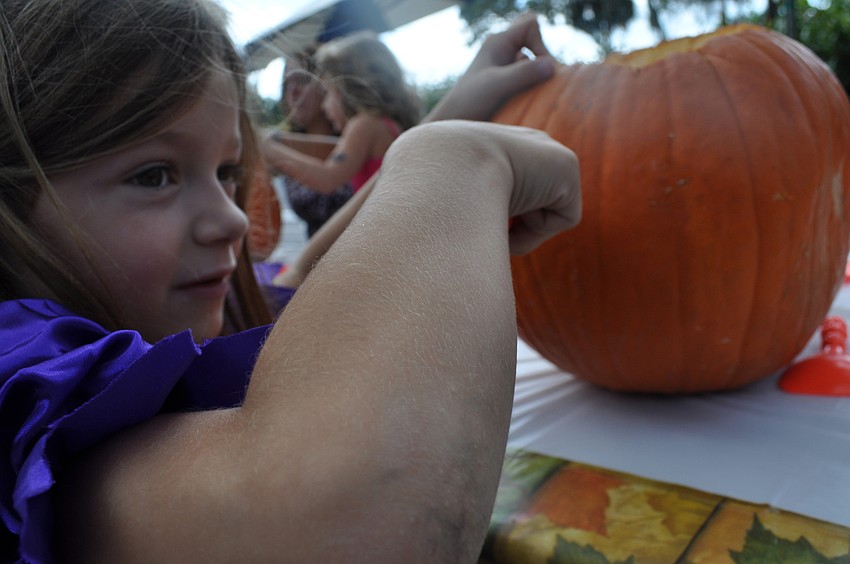 Ava Oâ€™Hara carves her pumpkin