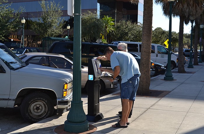Parking meter hourly rates rise from 50 cents to $1 today. File photo.