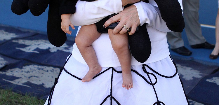 Angela Mejicanos dressed as a web and dressed her daughter, Stella, 7 mos., as an itsy bitsy spider, Monday, Oct. 31, at ODA.
