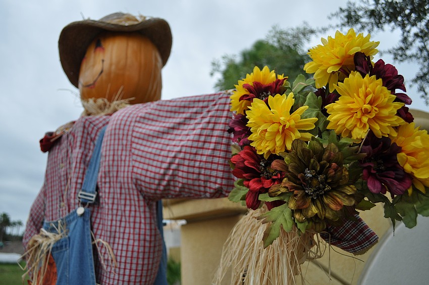 Can you tell us where this fall scarecrow resides? The first person to answer correctly gets a Facebook shout out.