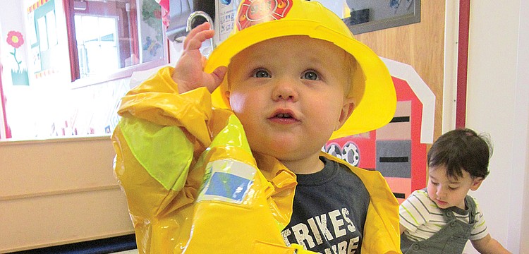 Gabe White tried on an entire firefighter outfit.