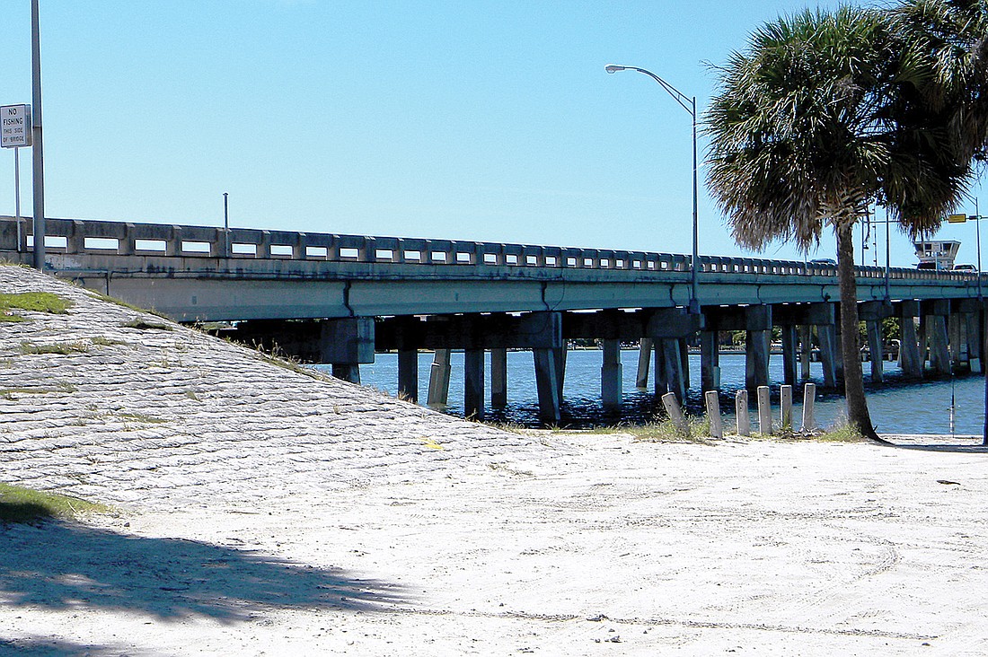 The Florida Department of Transportation has given county officials a permit to use its right of way at the north Siesta bridge for offloading spoil material from Palmer Point Park. Photo by Norman Schimmel.