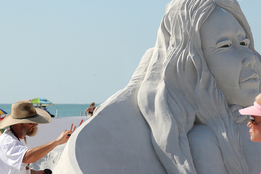 Master sandsculptor Bert Adams works on his creation, "Ying Yang," during the inaugural Crystal Classic in 2010 on Siesta Public Beach. File photo