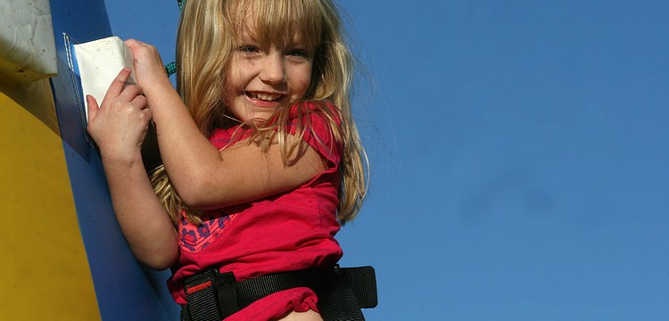 Danielle Richter, 3, braved the inflatable climbing course.