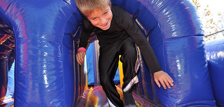 Bryce Andrews had fun racing through an inflatable obstacle course.