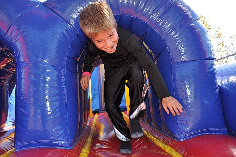 Bryce Andrews had fun racing through an inflatable obstacle course.