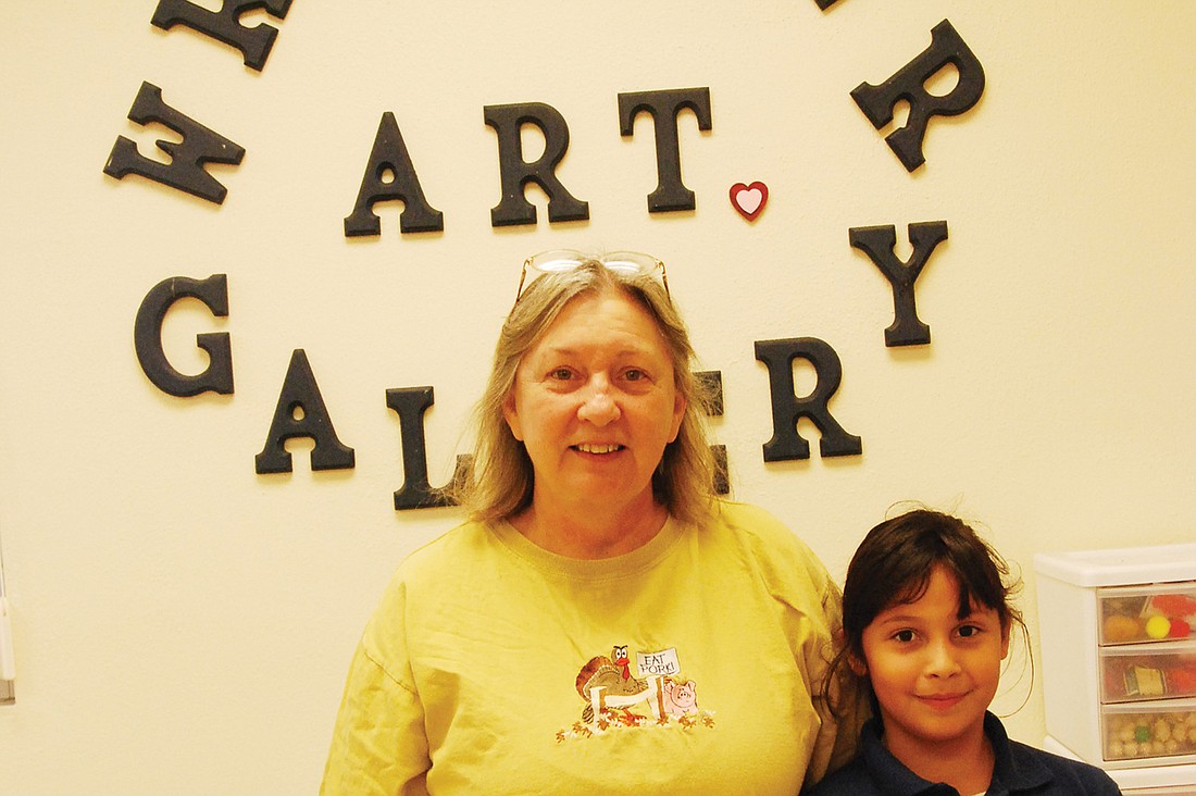 Jaysa Molina, right, BRE second-grader, with her art teacher, Dr. Donna Hart