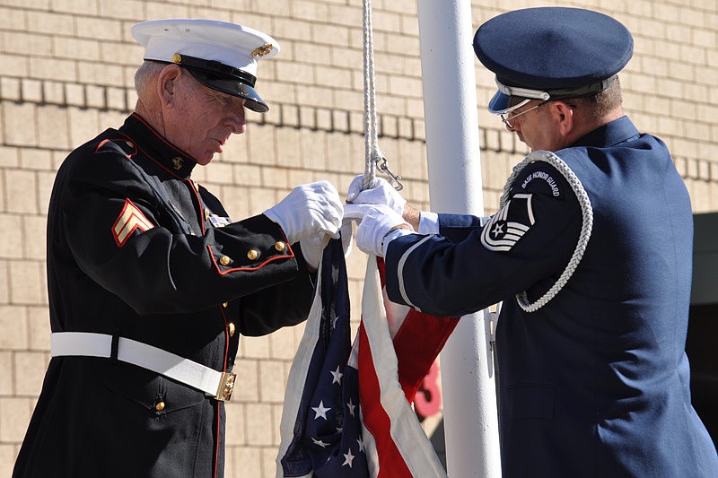 Cpl. Hurb Thompson and Master Sgt. Mark Corradino raised the flag.
