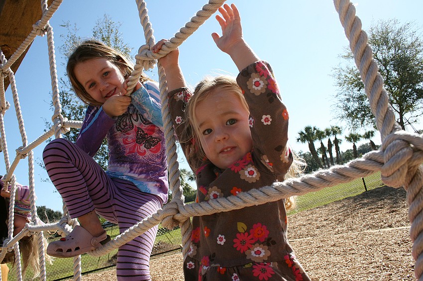 Ella and Mya Brauch had a blast at Bennett Park's grand opening.